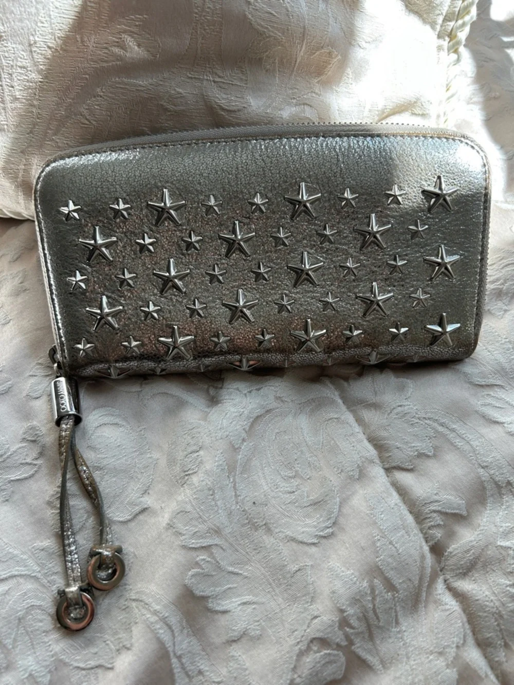 7021. Jimmy Choo Filipa Metallic Silver Star-Embellished Zip Around Wallet